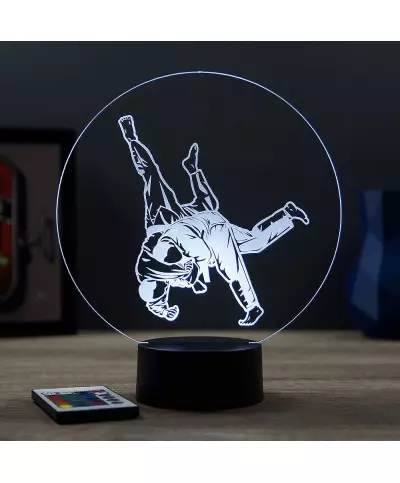 Lampe illusion 3D en verre acrylique gravée au laser représentant deux combattants de judo .