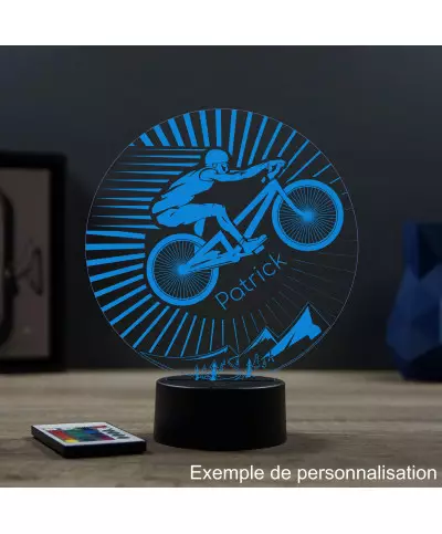 Lampe illusion 3D en verre acrylique gravée au laser représentant un cycliste sur son VTT.
