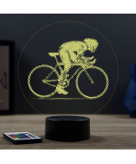 Lampe illusion 3D en verre acrylique gravée au laser représentant un cycliste sur son vélo de course.