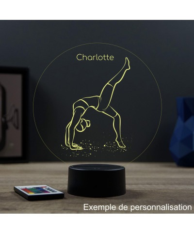 Lampe illusion 3D en verre acrylique gravée au laser représentant une gymnaste.