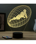 Lampe illusion 3D en verre acrylique gravée au laser représentant un joueur de rugby à l'intérieur d'un ballon.