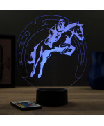 Lampe illusion 3D en verre acrylique gravée au laser représentant un cavalier sur son cheval qui saute.