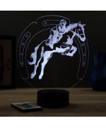 Lampe illusion 3D en verre acrylique gravée au laser représentant un cavalier sur son cheval qui saute.