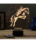 Lampe illusion 3D en verre acrylique gravée au laser représentant un cavalier sur son cheval qui saute.