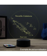 Lampe illusion 3D en verre acrylique gravée au laser représentant une carte de l'île de la Nouvelle Calédonie.