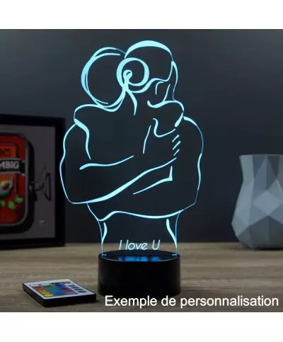 Lampe illusion 3D en verre acrylique gravée au laser représentant un couple tendrement enlacé.