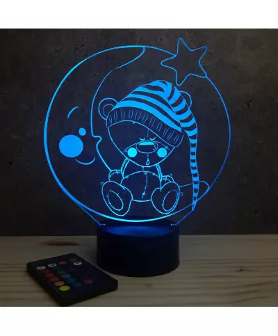 Lampe illusion 3D en verre acrylique gravée au laser représentant un nounours assis sur un croissant de lune.