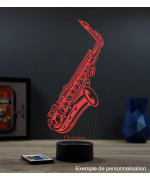 Lampe illusion 3D en verre acrylique gravée au laser représentant un saxophone.