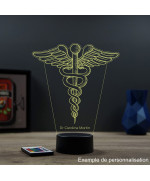 Lampe illusion 3D en verre acrylique gravée au laser représentant l'emblème du caducée.