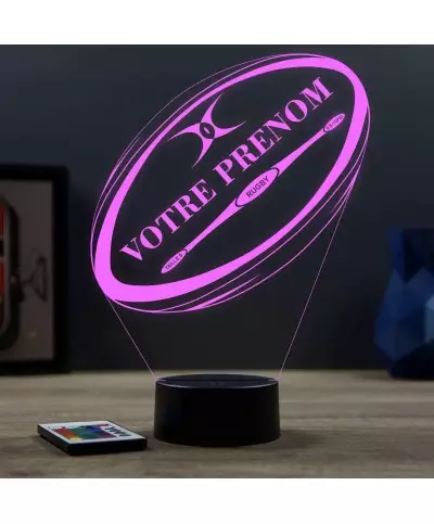 Lampe illusion 3D en verre acrylique gravée au laser représentant un ballon de rugby avec le prénom du joueur.