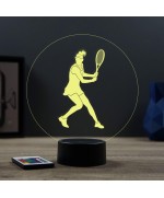 Lampe illusion 3D en verre acrylique gravée au laser représentant une joueuse de tennis à l'intérieur d'une balle de tennis.