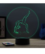 Lampe illusion 3D en verre acrylique gravée au laser représentant une gymnaste.